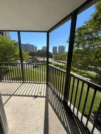 a view of balcony with wooden floor