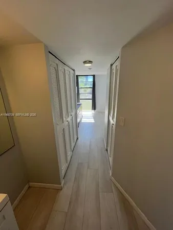 a view of a room with wooden floor and staircase