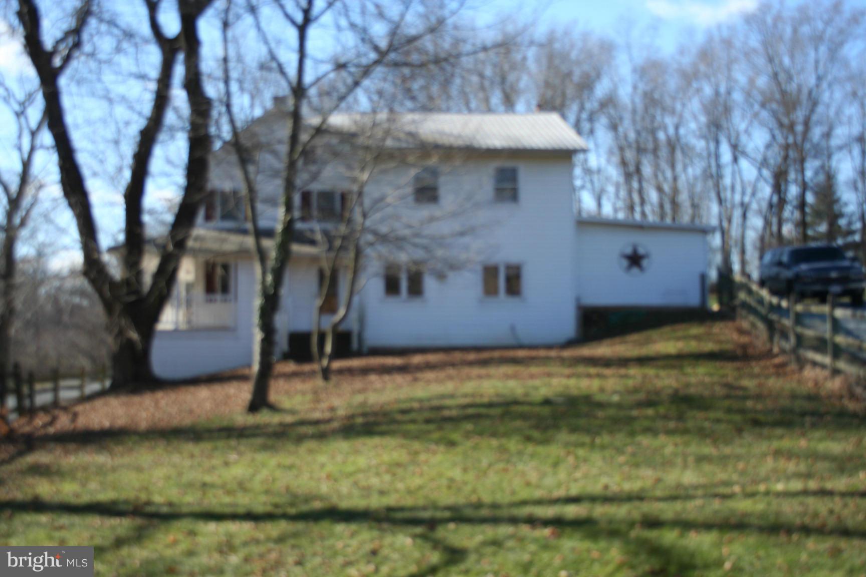 6028 Old Bohn Road Mount Airy, MD 21771 - Photo 2 of 9 a view of a house with a yard