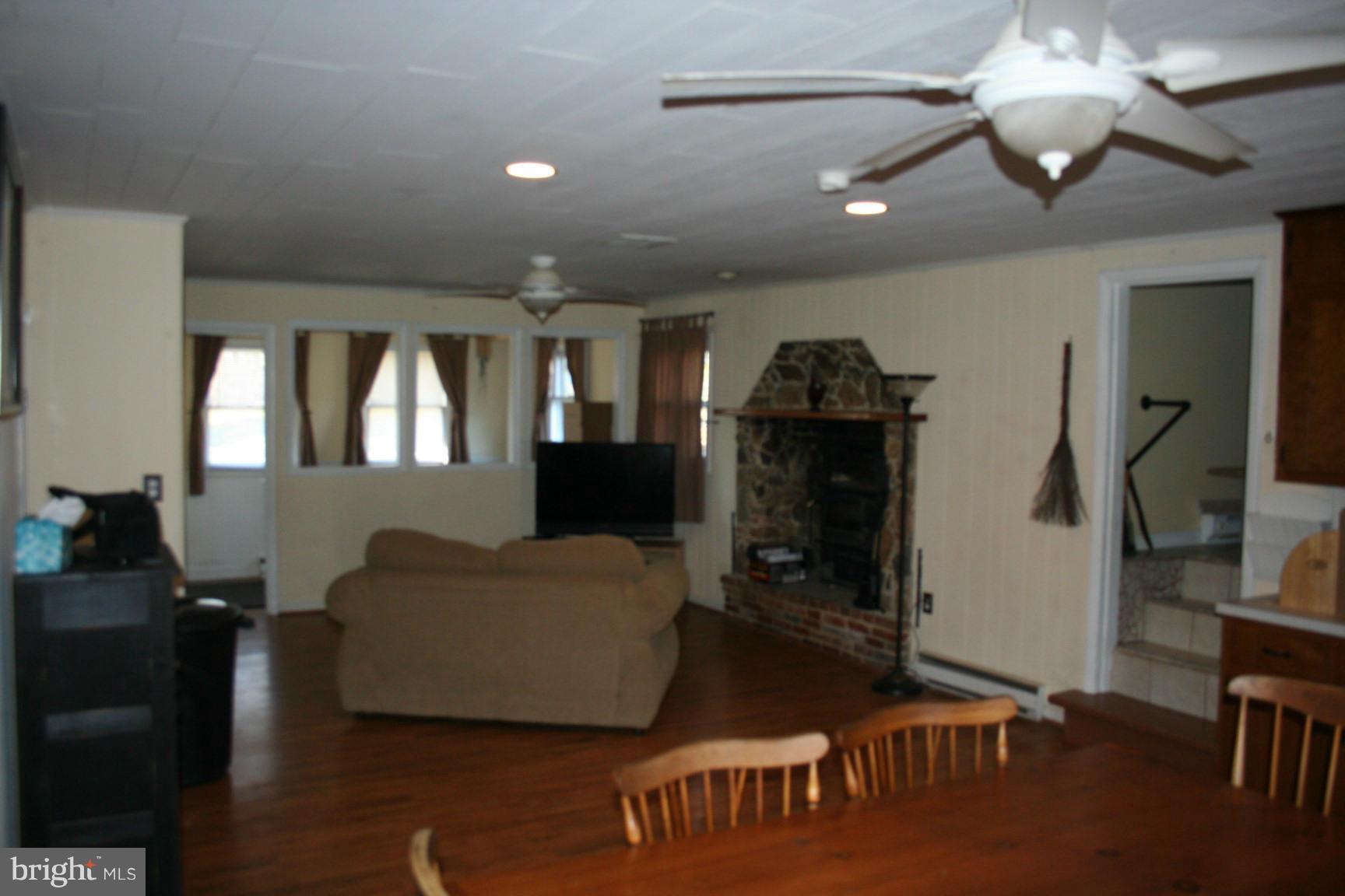 6028 Old Bohn Road Mount Airy, MD 21771 - Photo 5 of 9 a living room with furniture and a flat screen tv