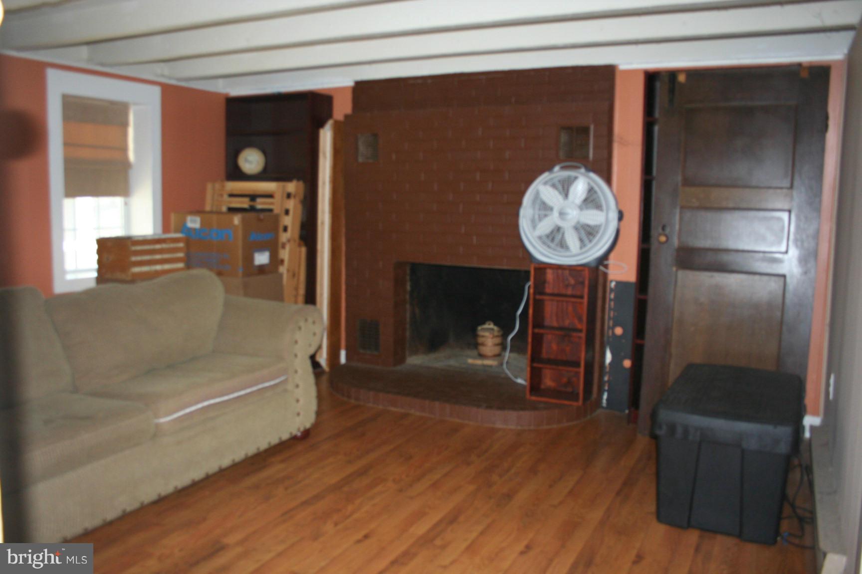 6028 Old Bohn Road Mount Airy, MD 21771 - Photo 6 of 9 a living room with furniture and a clock