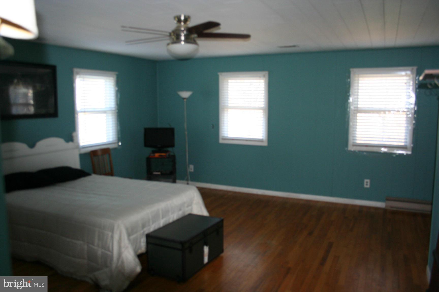 6028 Old Bohn Road Mount Airy, MD 21771 - Photo 8 of 9 a bedroom with a bed and a window