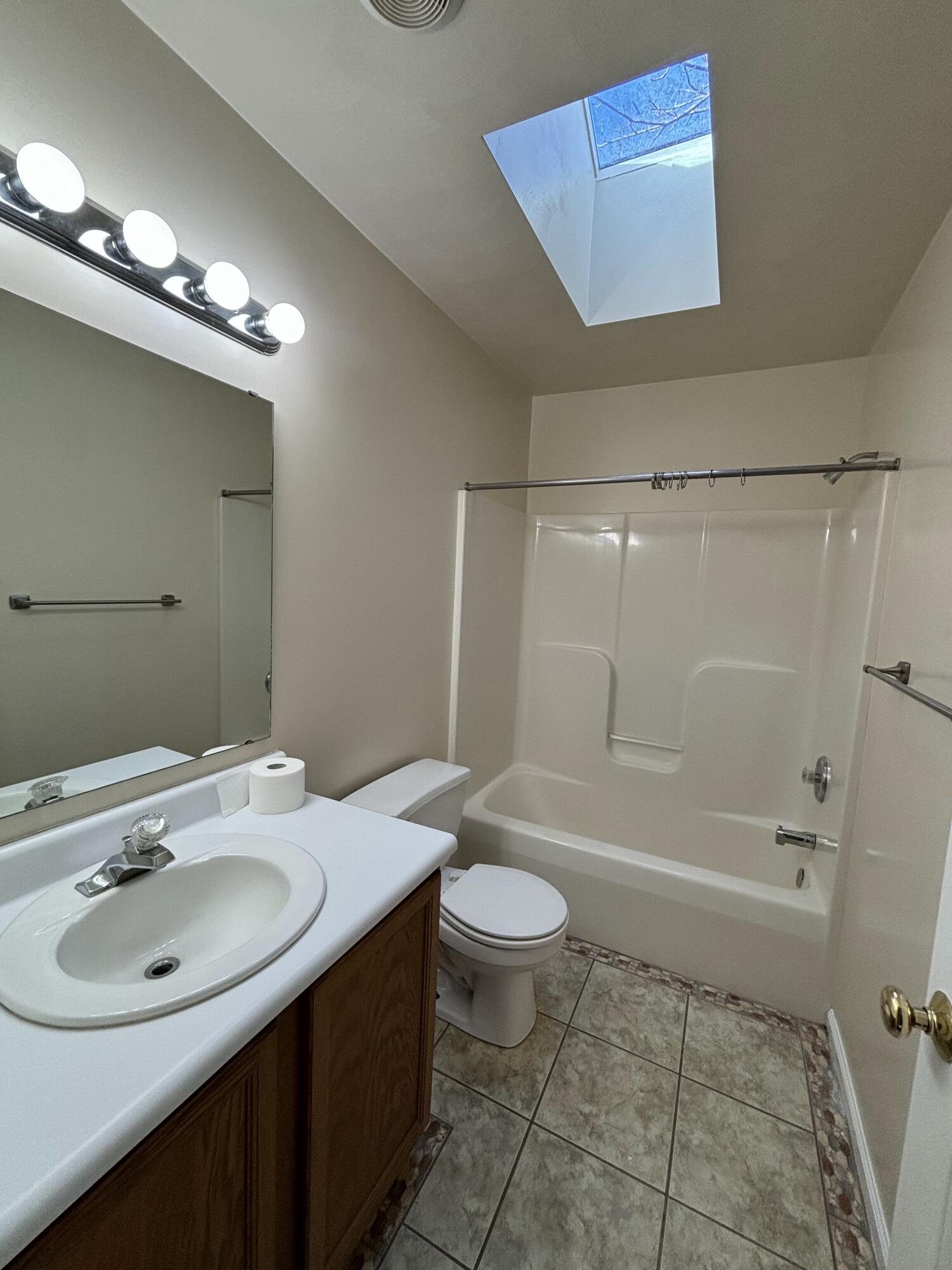 2719 Bandy Road Roanoke, VA 24014 - Photo 11 of 33 a bathroom with a sink a toilet and shower