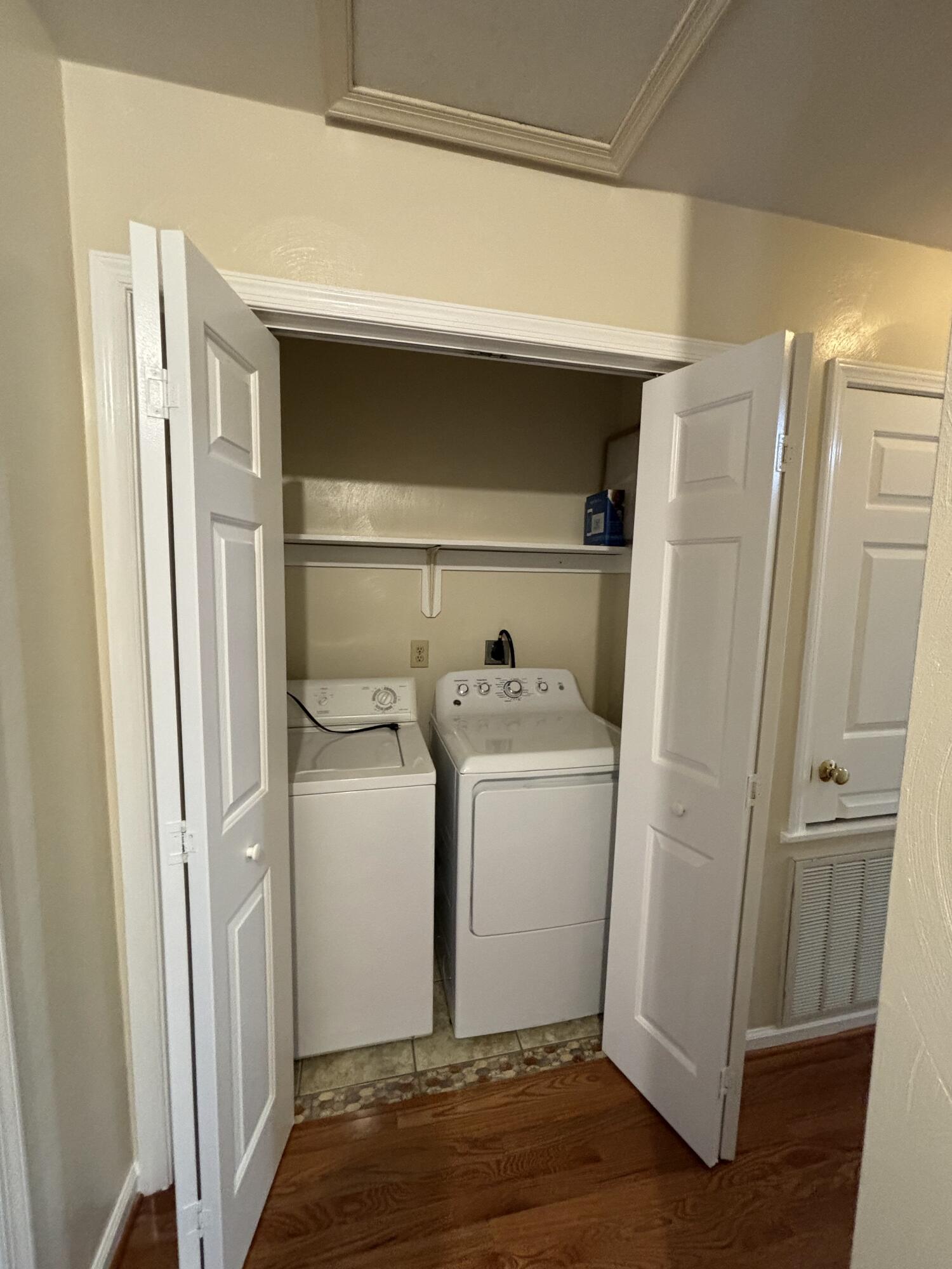 2719 Bandy Road Roanoke, VA 24014 - Photo 12 of 33 a utility room with cabinets washer and dryer
