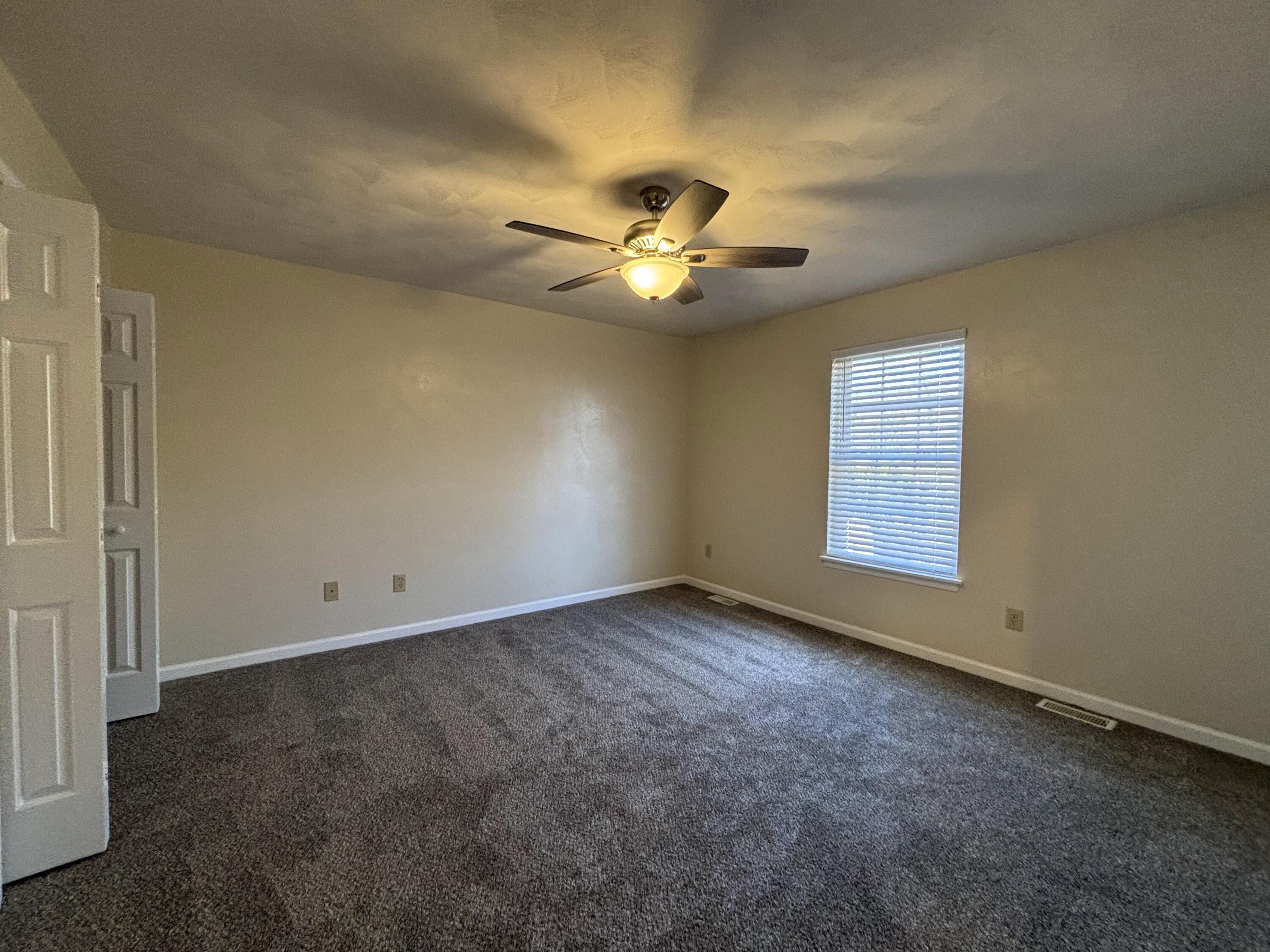 2719 Bandy Road Roanoke, VA 24014 - Photo 13 of 33 an empty room with windows and fan
