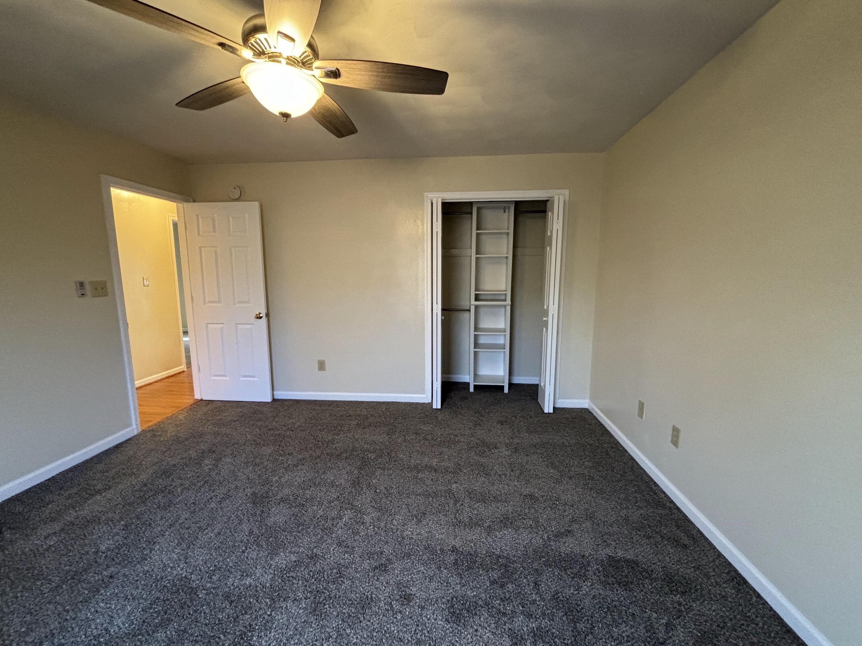 2719 Bandy Road Roanoke, VA 24014 - Photo 14 of 33 an empty room with closet and a chandelier fan