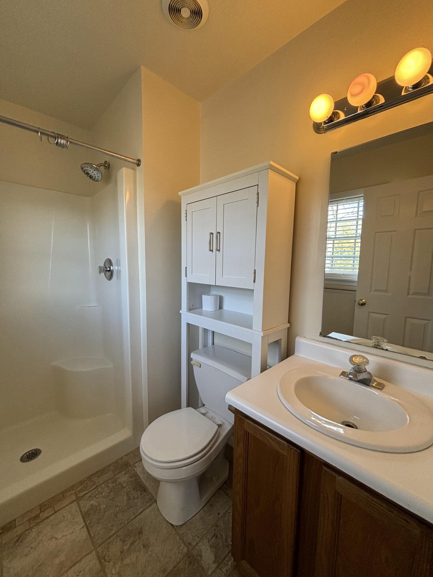 2719 Bandy Road Roanoke, VA 24014 - Photo 16 of 33 a bathroom with a sink a toilet and shower