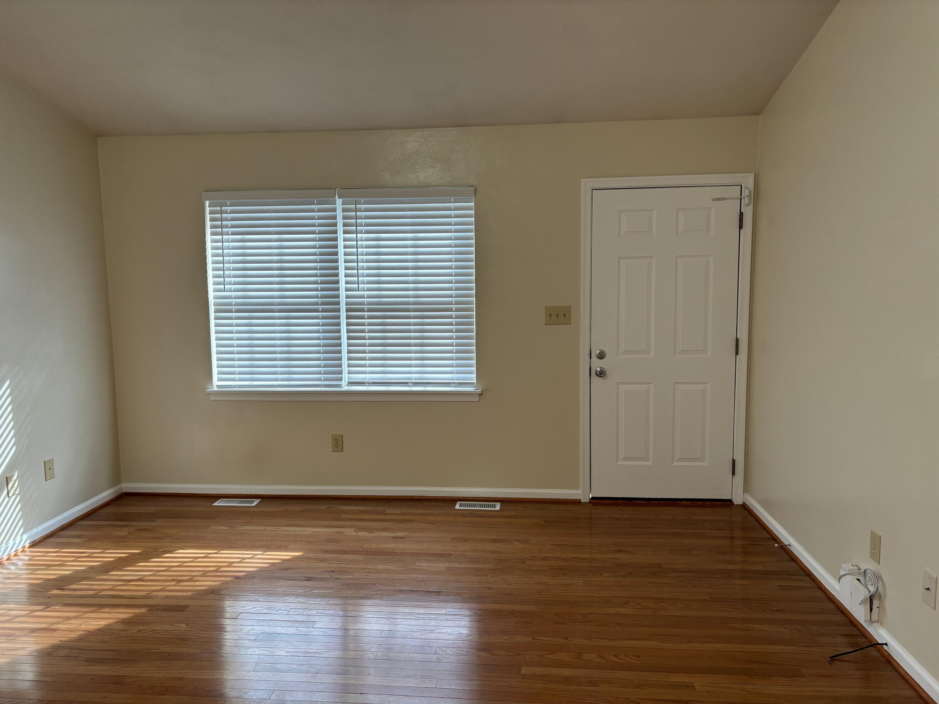 2719 Bandy Road Roanoke, VA 24014 - Photo 3 of 33 an empty room with wooden floor and a window