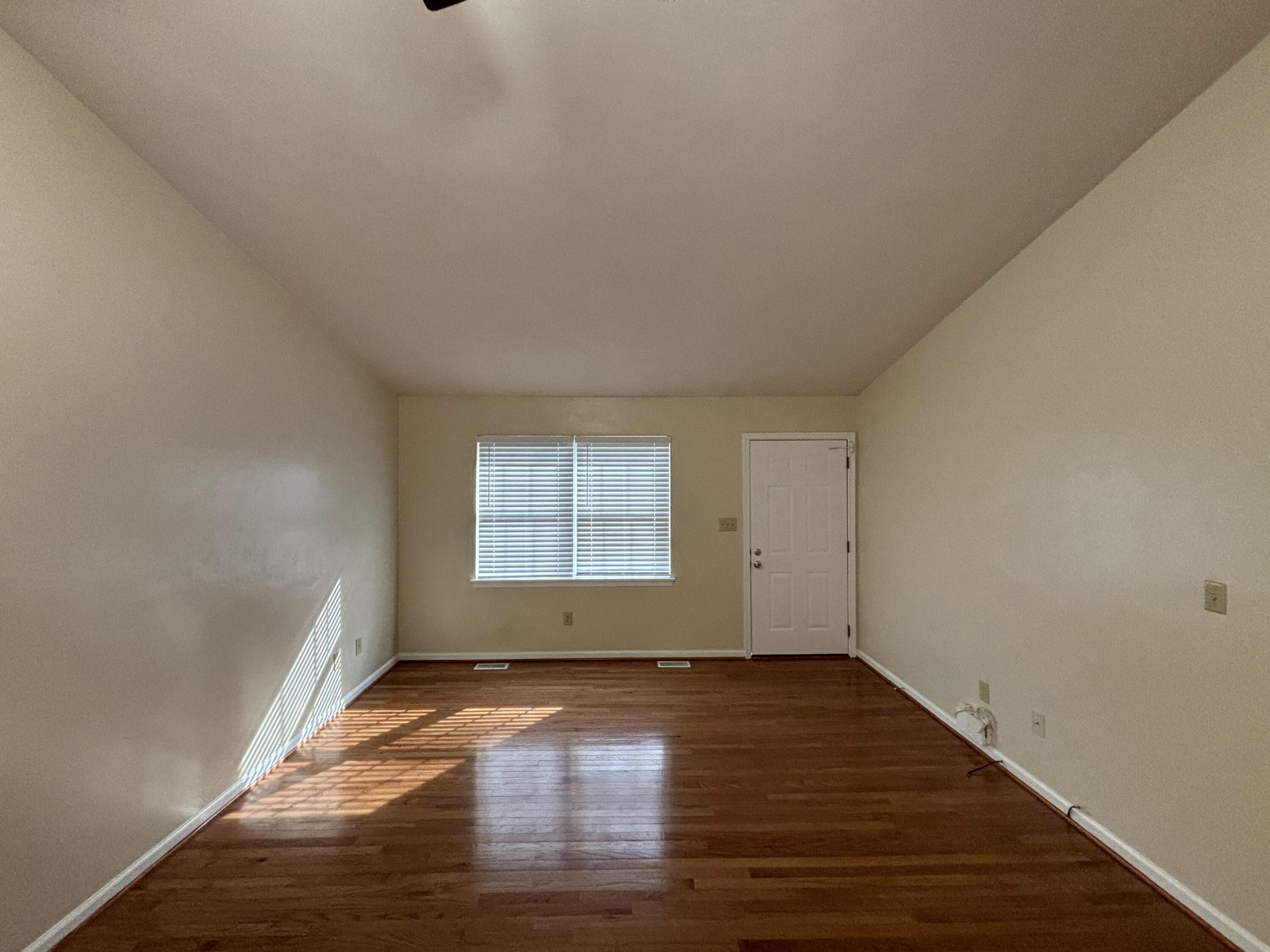 2719 Bandy Road Roanoke, VA 24014 - Photo 4 of 33 an empty room with wooden floor and windows