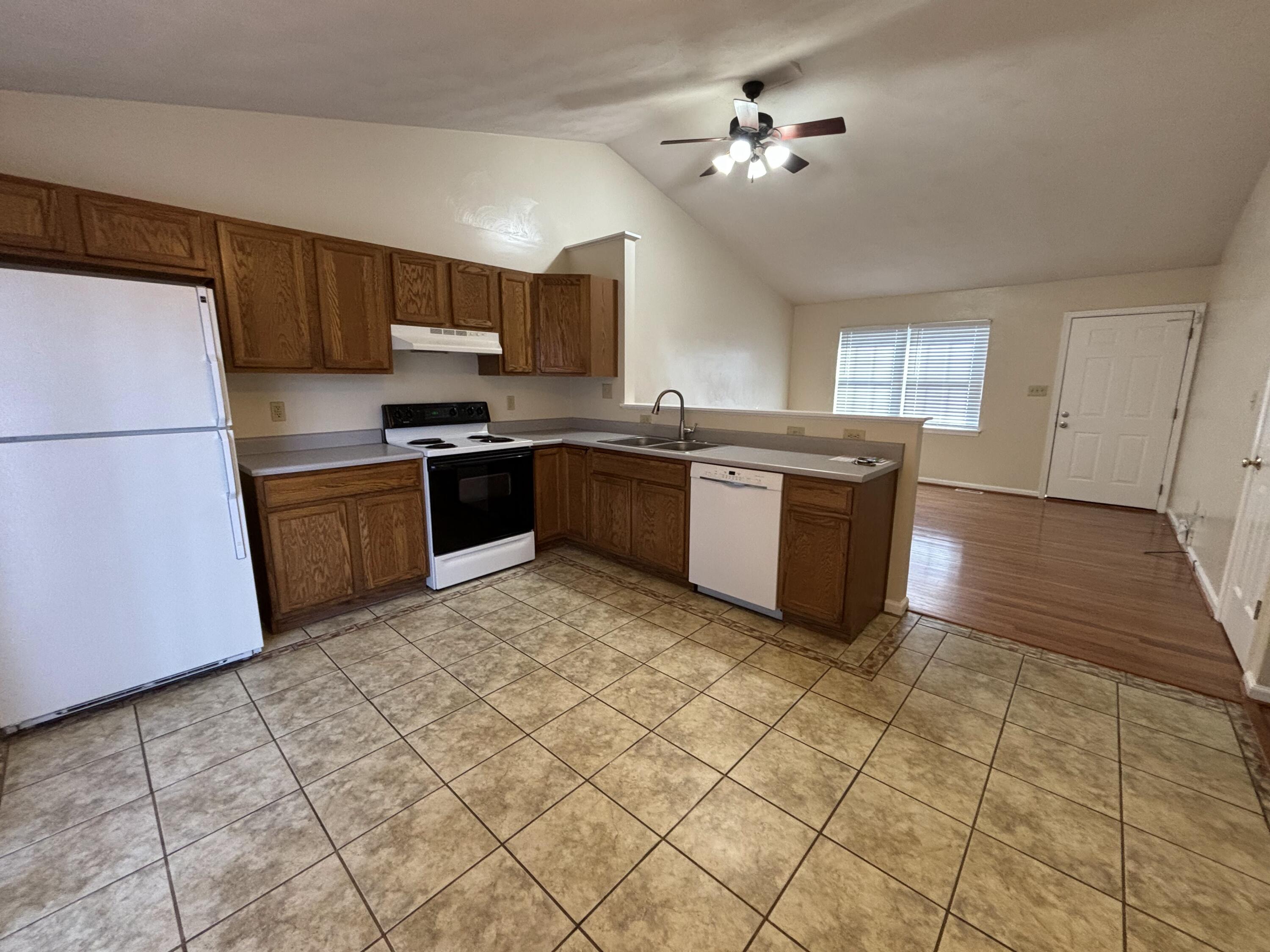 2719 Bandy Road Roanoke, VA 24014 - Photo 8 of 33 a kitchen with stainless steel appliances granite countertop a stove a sink and a refrigerator