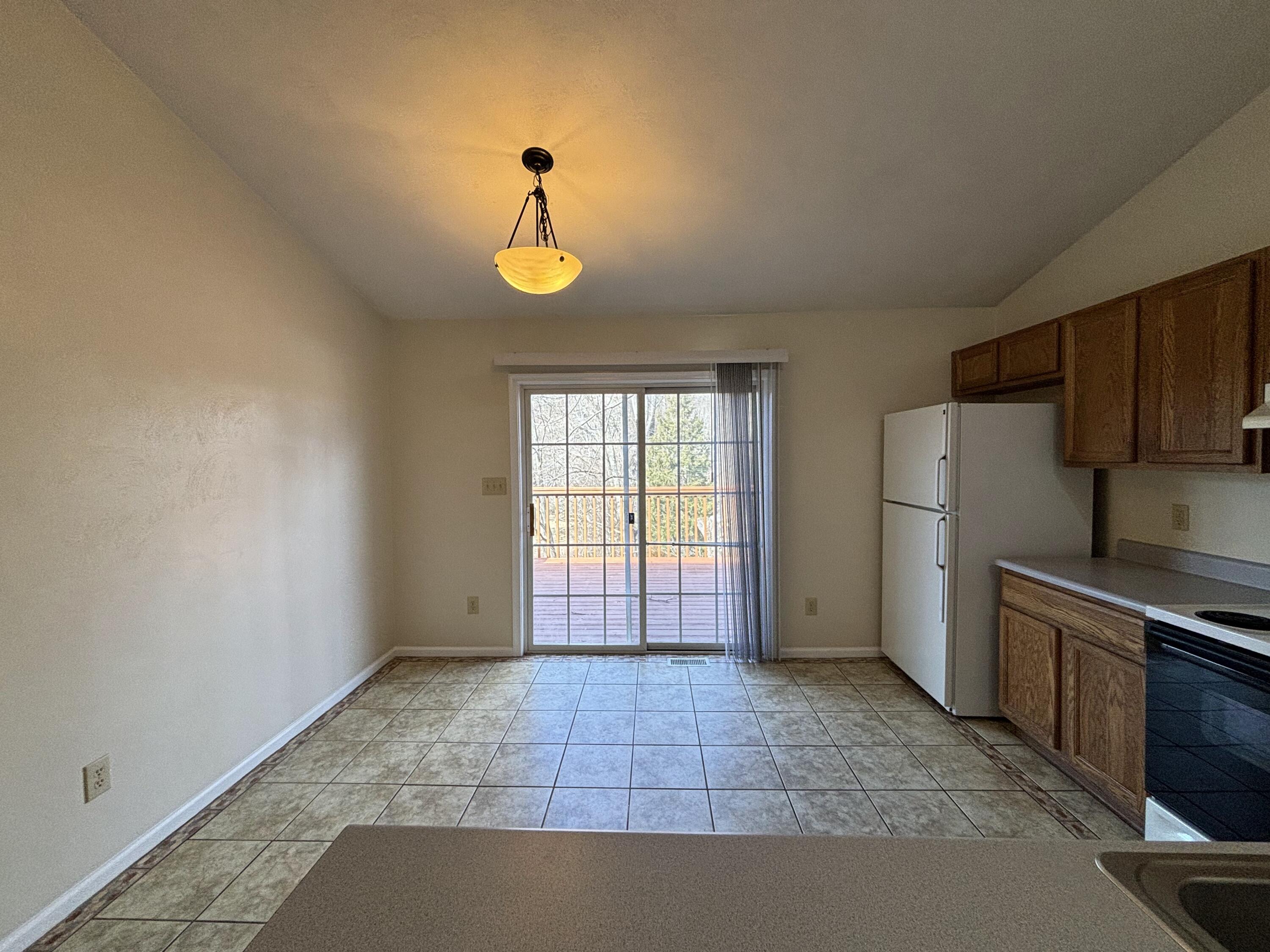 2719 Bandy Road Roanoke, VA 24014 - Photo 10 of 33 a view of a kitchen with a sink dishwasher and a refrigerator
