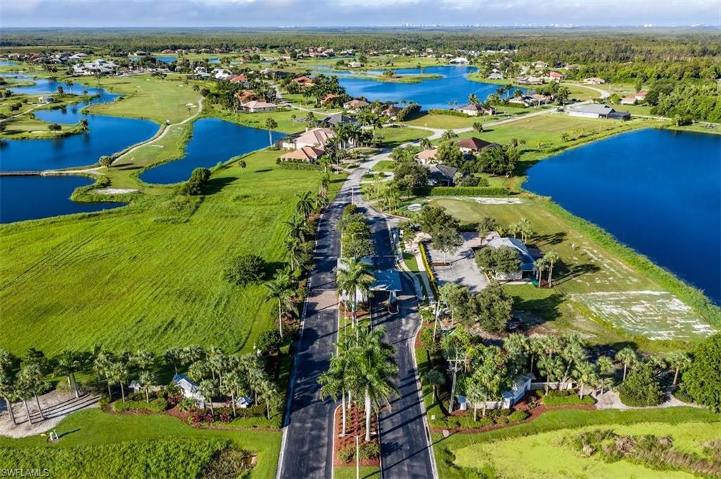 18656 Royal Hammock Boulevard Naples, FL 34114 - Photo 4 of 5 an aerial view of a residential houses with outdoor space and river view