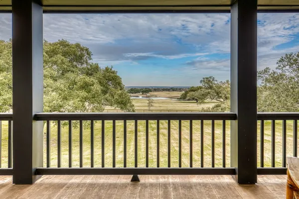 a view of a balcony with an outdoor space