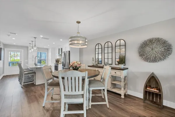a kitchen with a cabinets and wooden floor