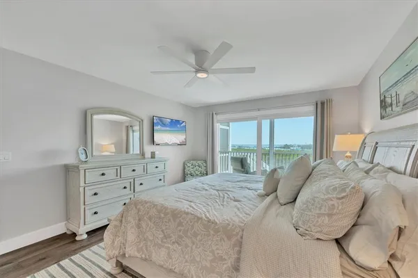 a bedroom with a bed and a night stand