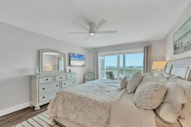 a bedroom with a bed and a night stand