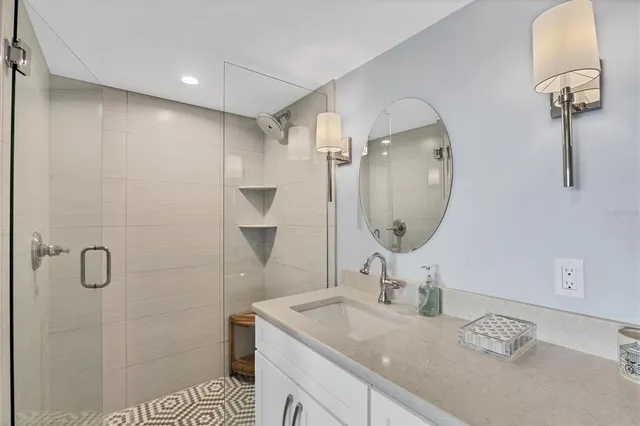 a spacious bedroom with a bed and a couch