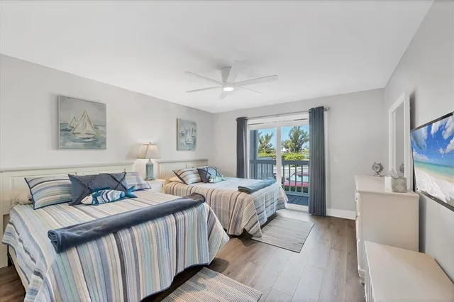 a bedroom with double bed and a window