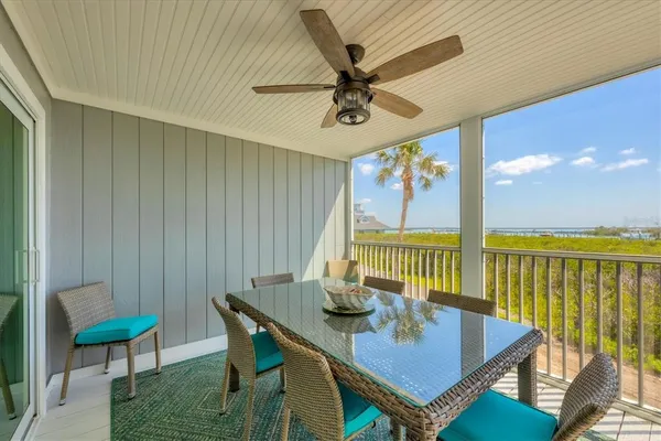 a view of a dining room with furniture wooden floor and chandelier
