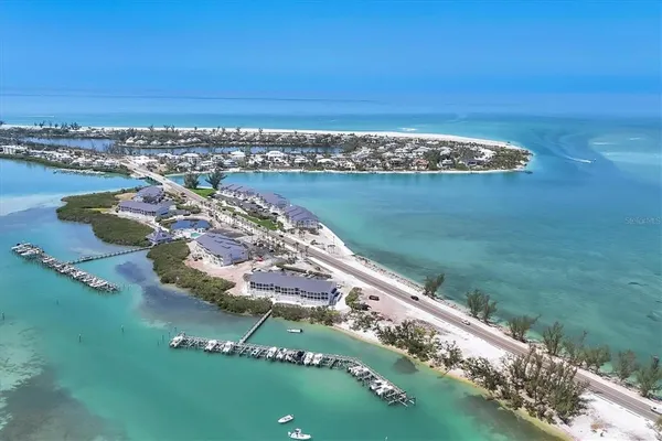 an aerial view of a house with a lake view