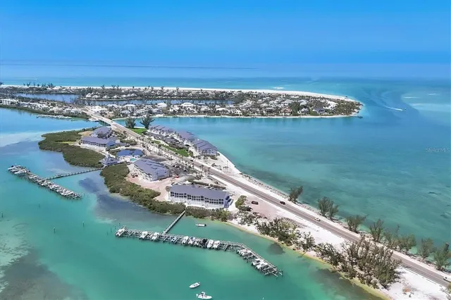 an aerial view of a house with a lake view