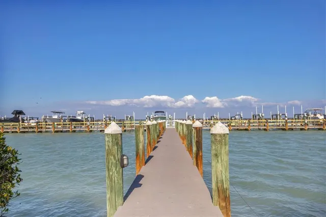 an aerial view of a city with lots of residential buildings lake and ocean view
