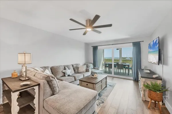 a living room with furniture and a large window