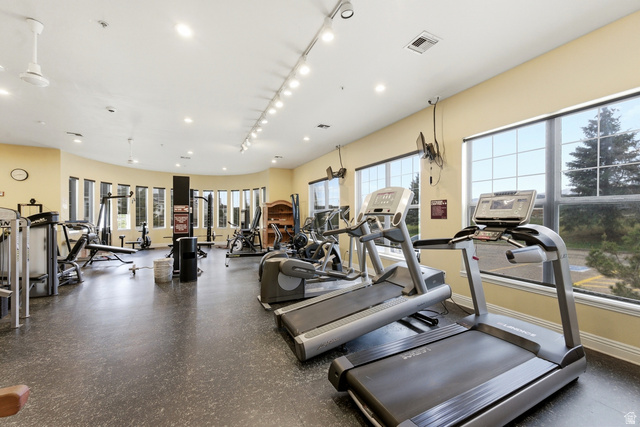 900 Bitner Road, Unit P20 Park City, UT 84098 - Photo 36 of 42 Fitness center featuring multiple treadmills, exercise equipment, expansive windows, recessed lighting, and resilient rubber flooring