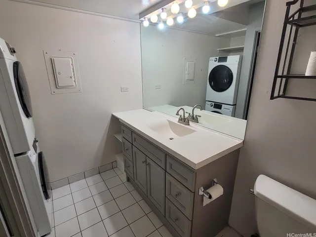 a bathroom with a sink toilet and vanity