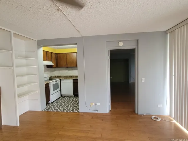a view of kitchen with a sink and cabinets