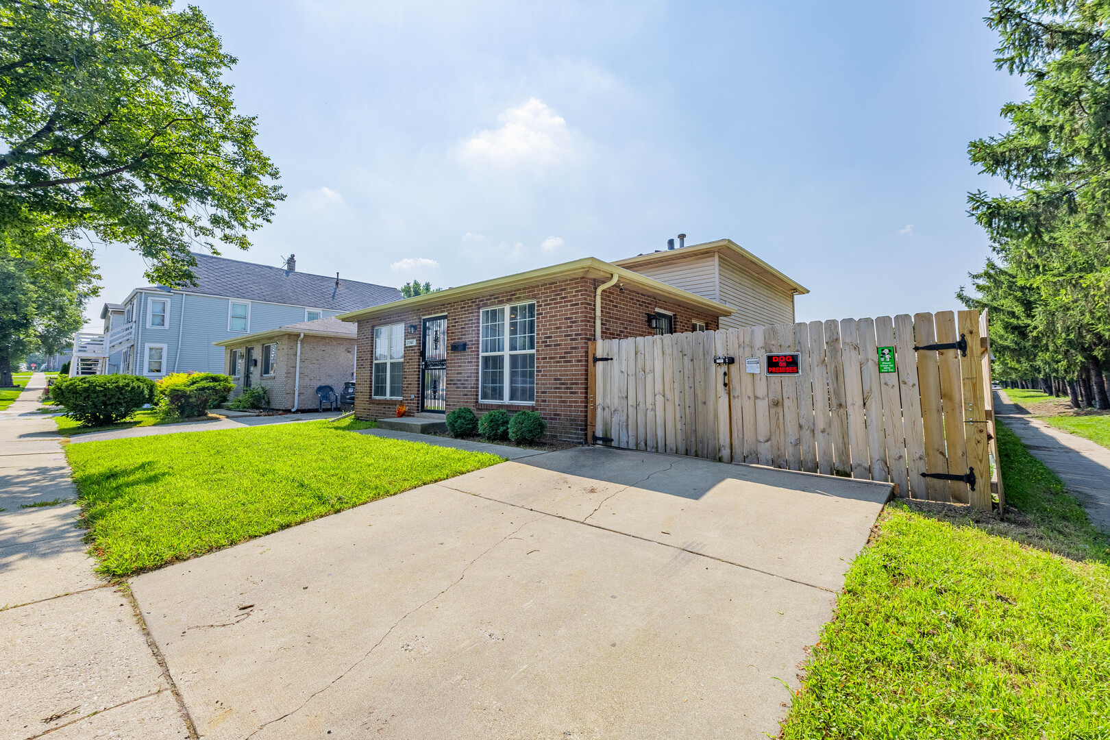 7747 West 62nd Street Summit, IL 60501 - Photo 23 of 23 a front view of a house with a yard and garage