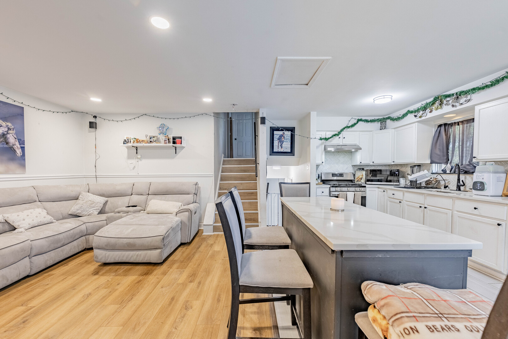7747 West 62nd Street Summit, IL 60501 - Photo 3 of 23 a living room with stainless steel appliances furniture and a kitchen view