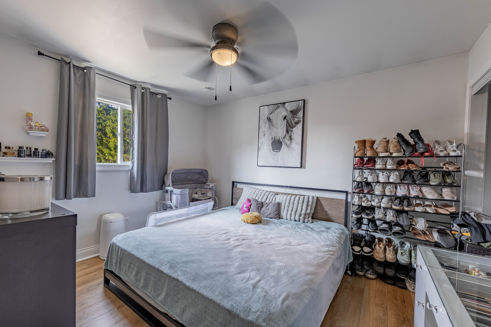 7747 West 62nd Street Summit, IL 60501 - Photo 10 of 23 a bedroom with a large bed and a chandelier