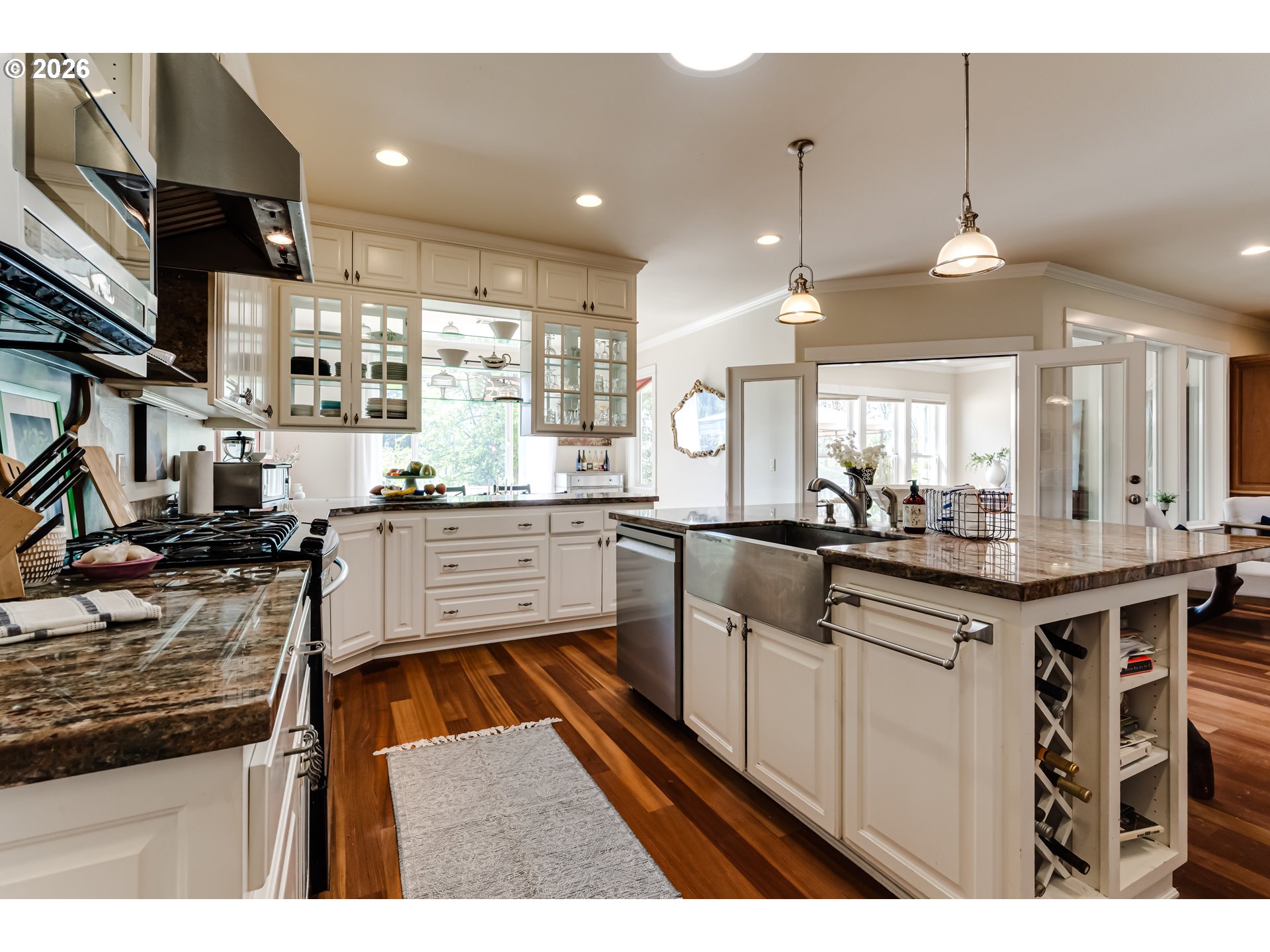 34386 Mathews Road Eugene, OR 97405 - Photo 32 of 48 a kitchen with stainless steel appliances granite countertop a sink a stove and a wooden floors