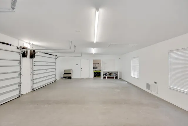 a view of a swimming pool with outdoor seating