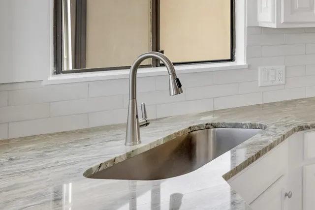 a view of a chairs and table in the patio