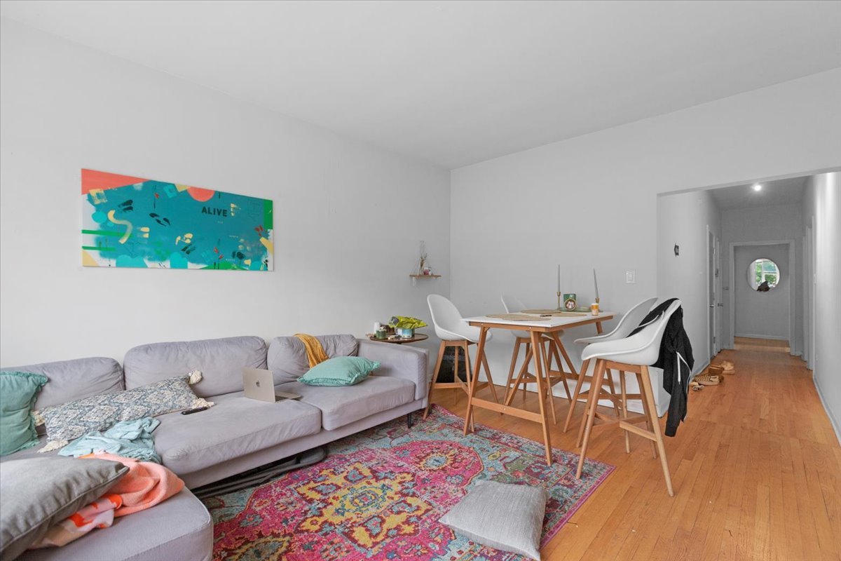2453 North Clark Street, Unit 3 Chicago, IL 60614 - Photo 4 of 11 a living room with furniture and a couch