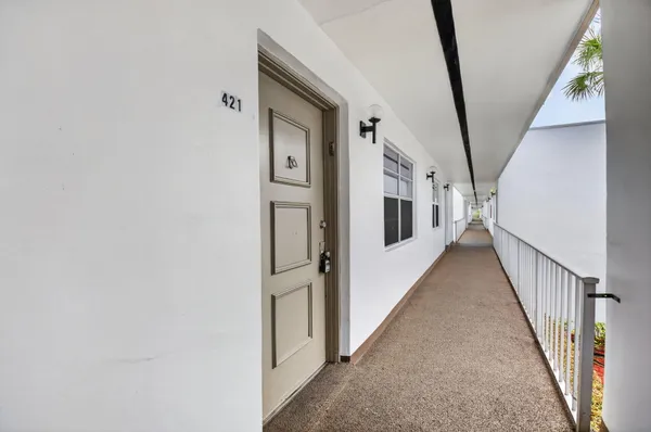 a view of a hallway with staircase