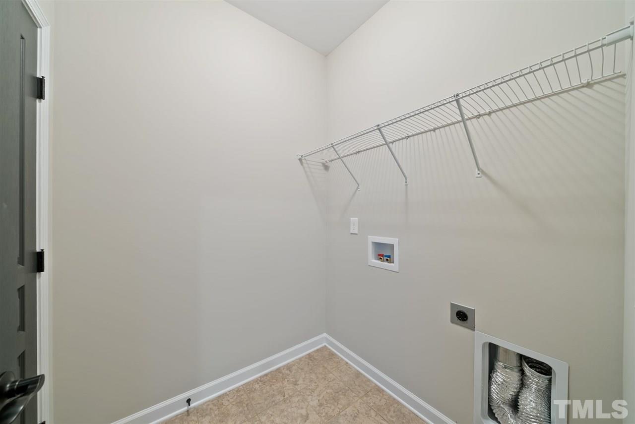 95 South Sunset Ridge Drive Willow Spring, NC 27592 - Photo 18 of 24 a bathroom with a shower and vanity