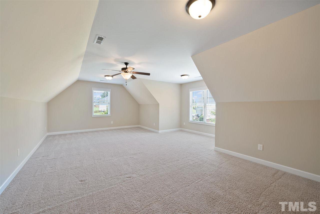 95 South Sunset Ridge Drive Willow Spring, NC 27592 - Photo 22 of 24 an empty room with windows and entrance