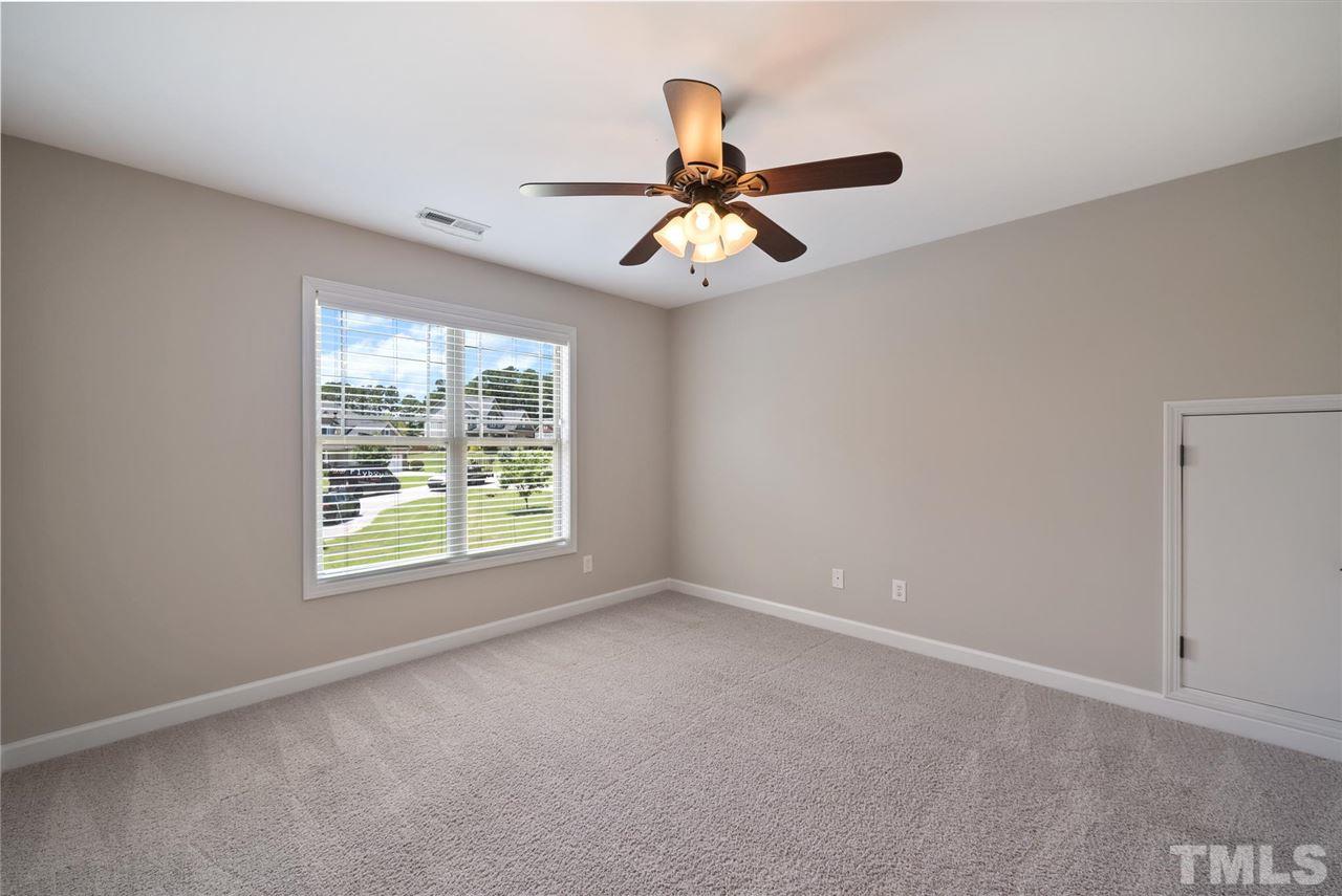95 South Sunset Ridge Drive Willow Spring, NC 27592 - Photo 23 of 24 a view of an empty room with a window