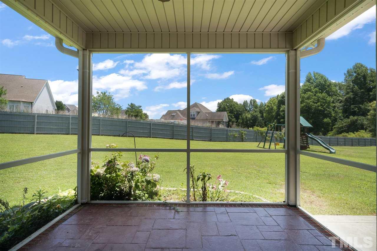 95 South Sunset Ridge Drive Willow Spring, NC 27592 - Photo 6 of 24 a view of a swimming pool with a porch