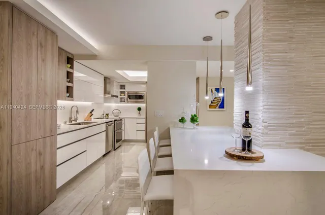 a kitchen with white cabinets and appliances