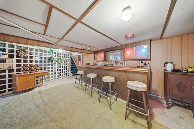 a kitchen with stainless steel appliances granite countertop a stove a sink and a dining table