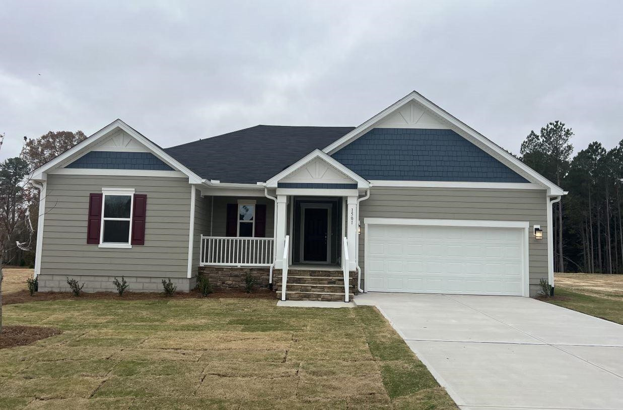 1501 Willow Lndg Way Willow Spring, NC 27592 - Photo 1 of 15 a front view of a house