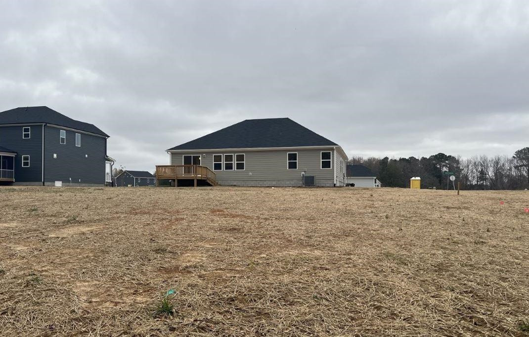 1501 Willow Lndg Way Willow Spring, NC 27592 - Photo 6 of 15 a front view of a house with a yard