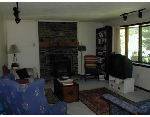 300 Petersham Road Hardwick, MA 01037 - Photo 9 of 19 a living room with furniture a fireplace and a flat screen tv