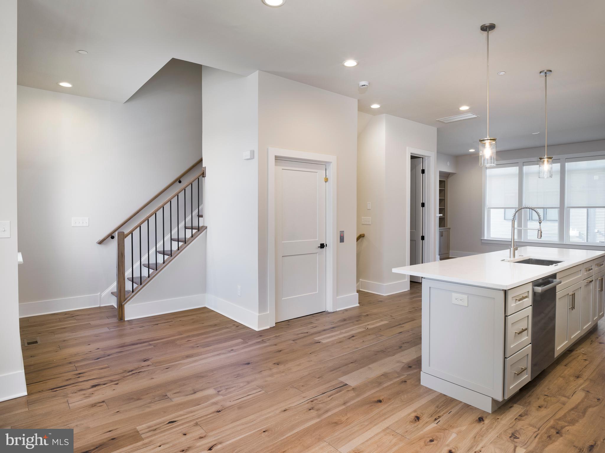 354 Paddock Circle Newtown Square, PA 19073 - Photo 12 of 36 a kitchen with a sink and a wooden floor
