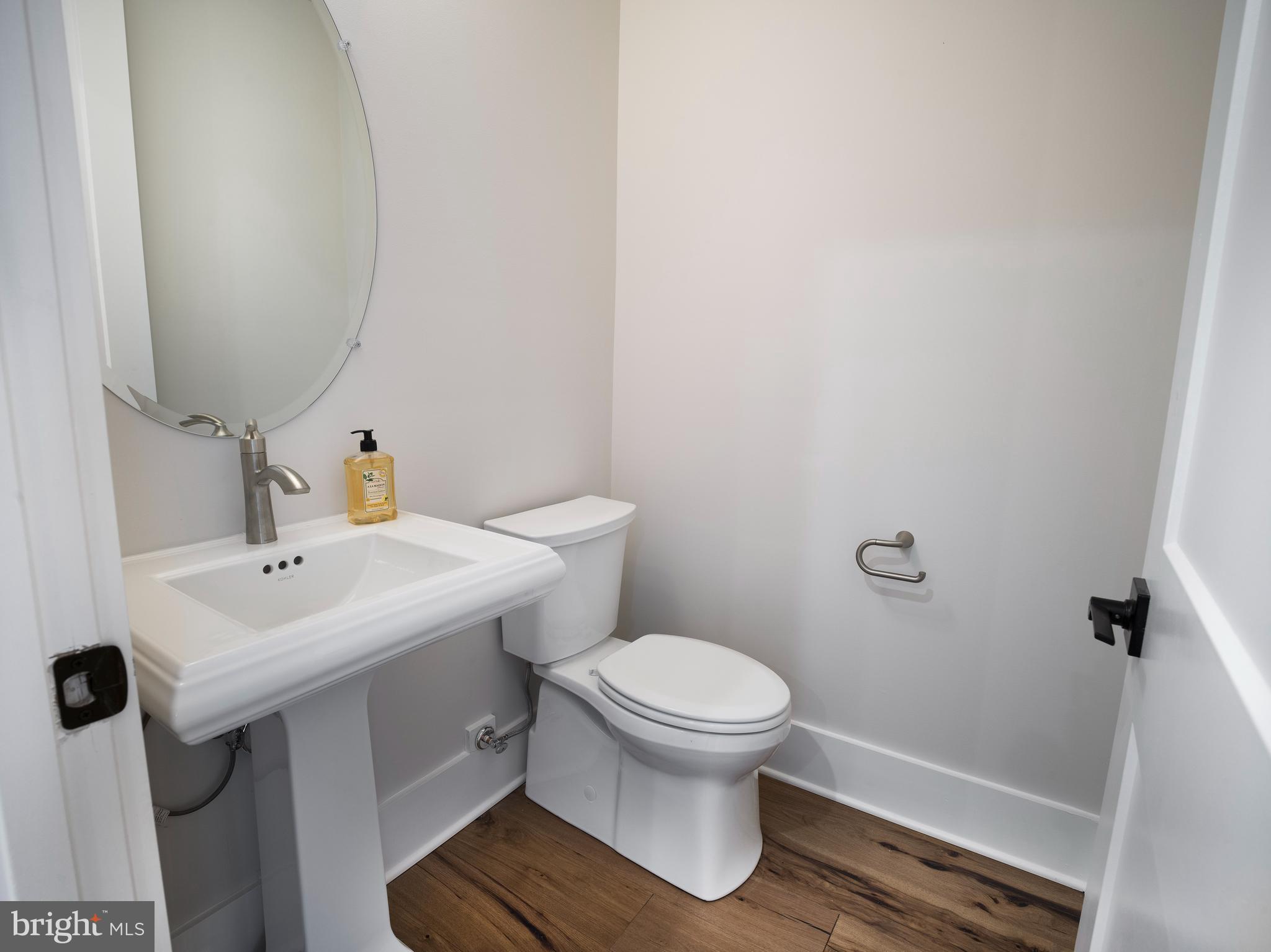 354 Paddock Circle Newtown Square, PA 19073 - Photo 15 of 36 a bathroom with a sink toilet and a mirror