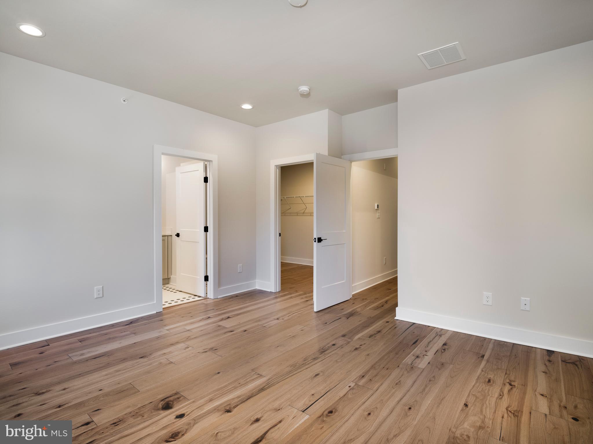 354 Paddock Circle Newtown Square, PA 19073 - Photo 17 of 36 a view of an empty room with wooden floor and closet